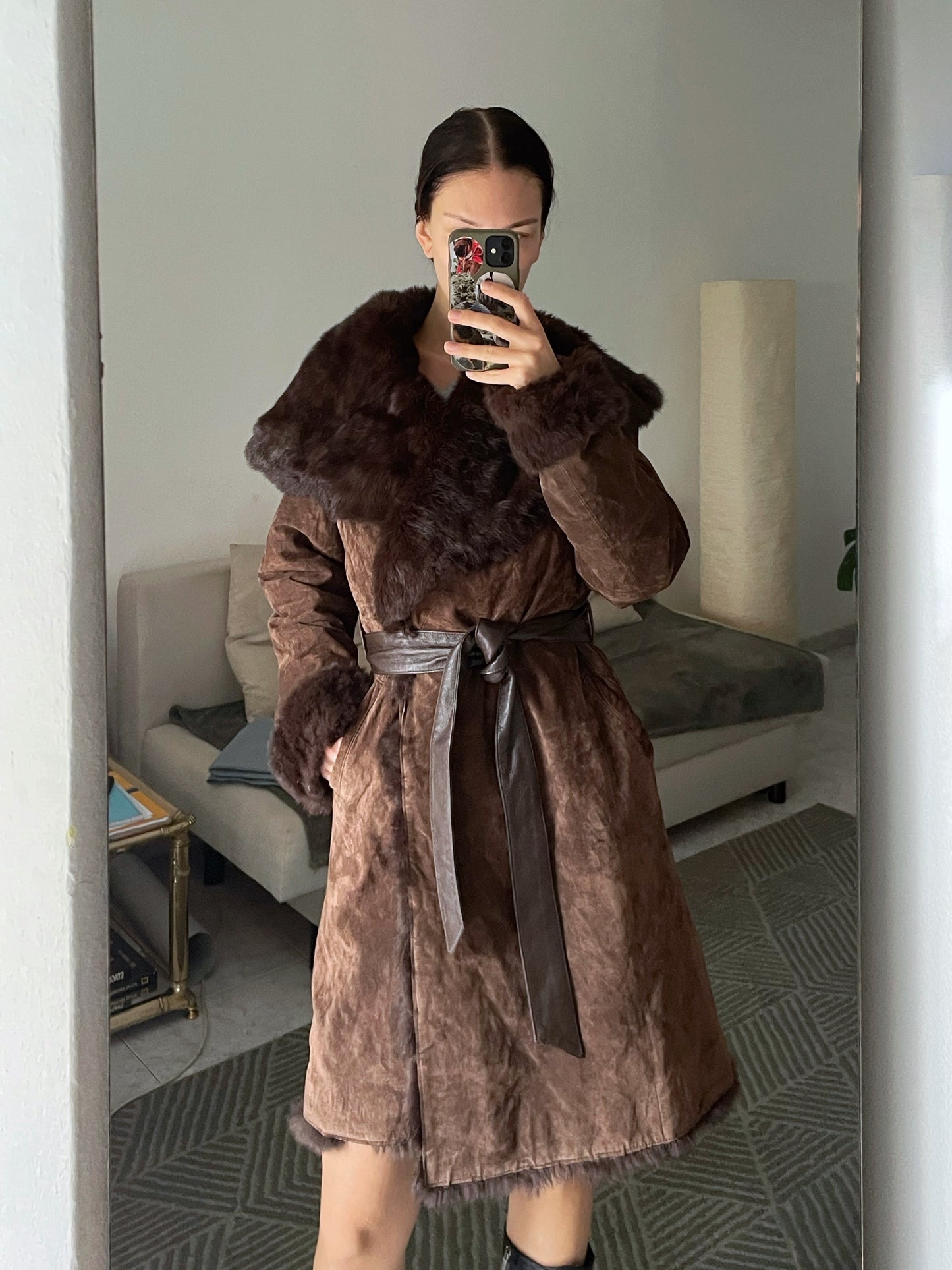 Suede coat with a fur collar.