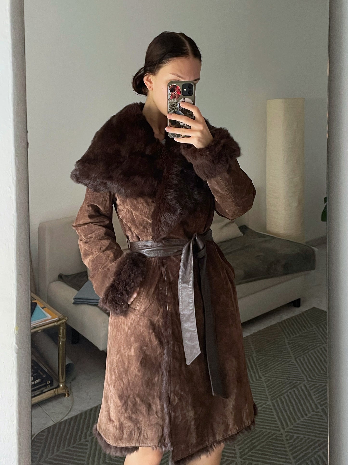 Suede coat with a fur collar.