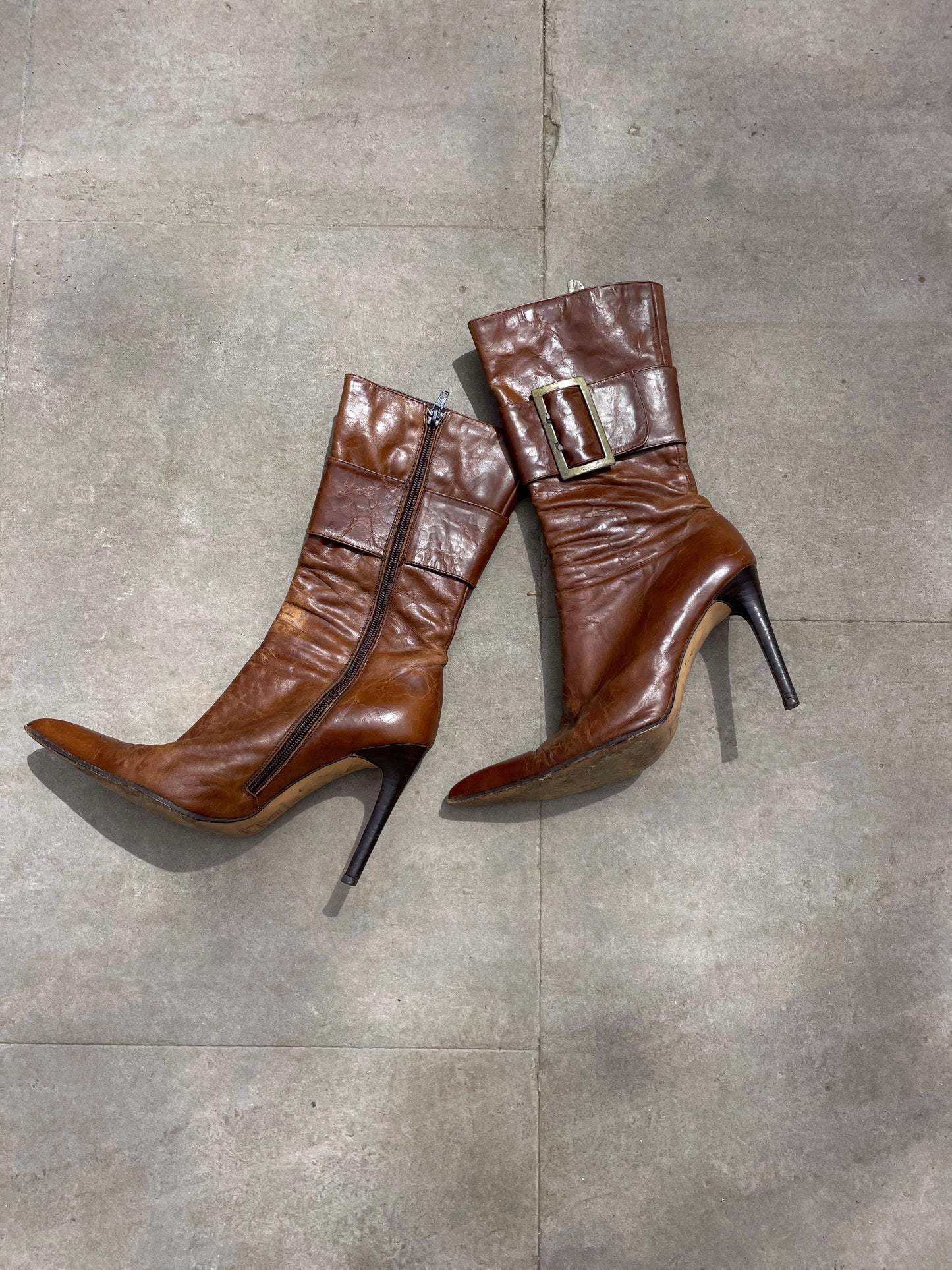 Buckled hight heel boots.
