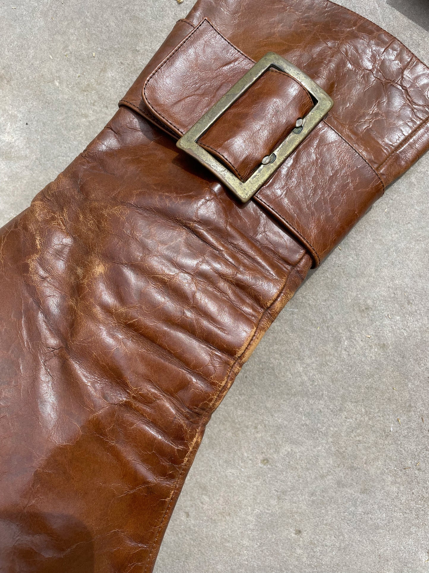 Buckled hight heel boots.