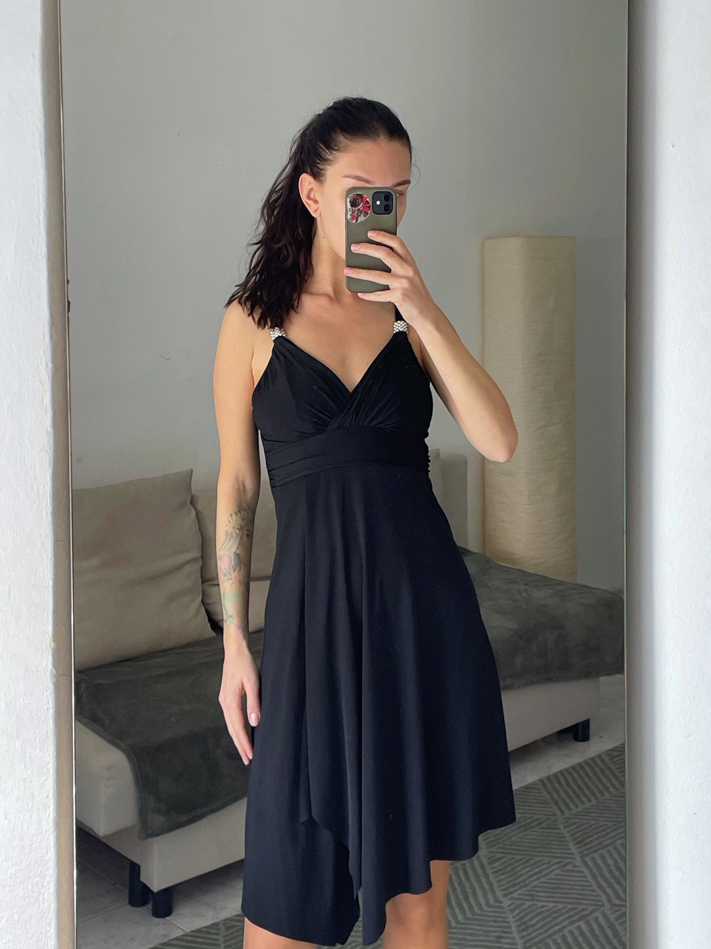 Mini black dress.