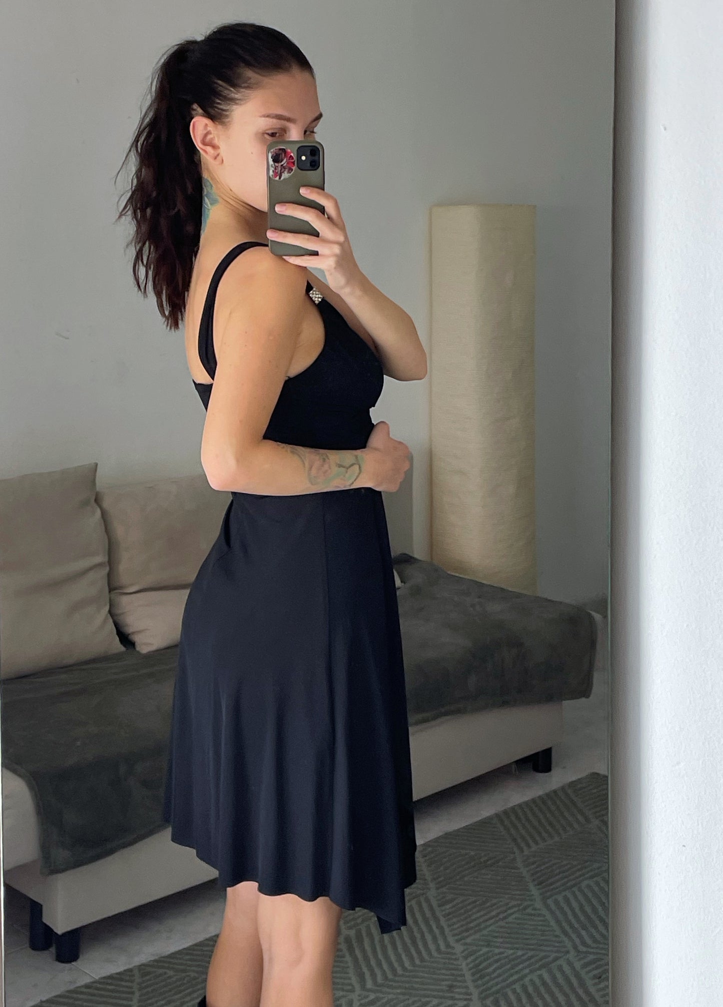 Mini black dress.