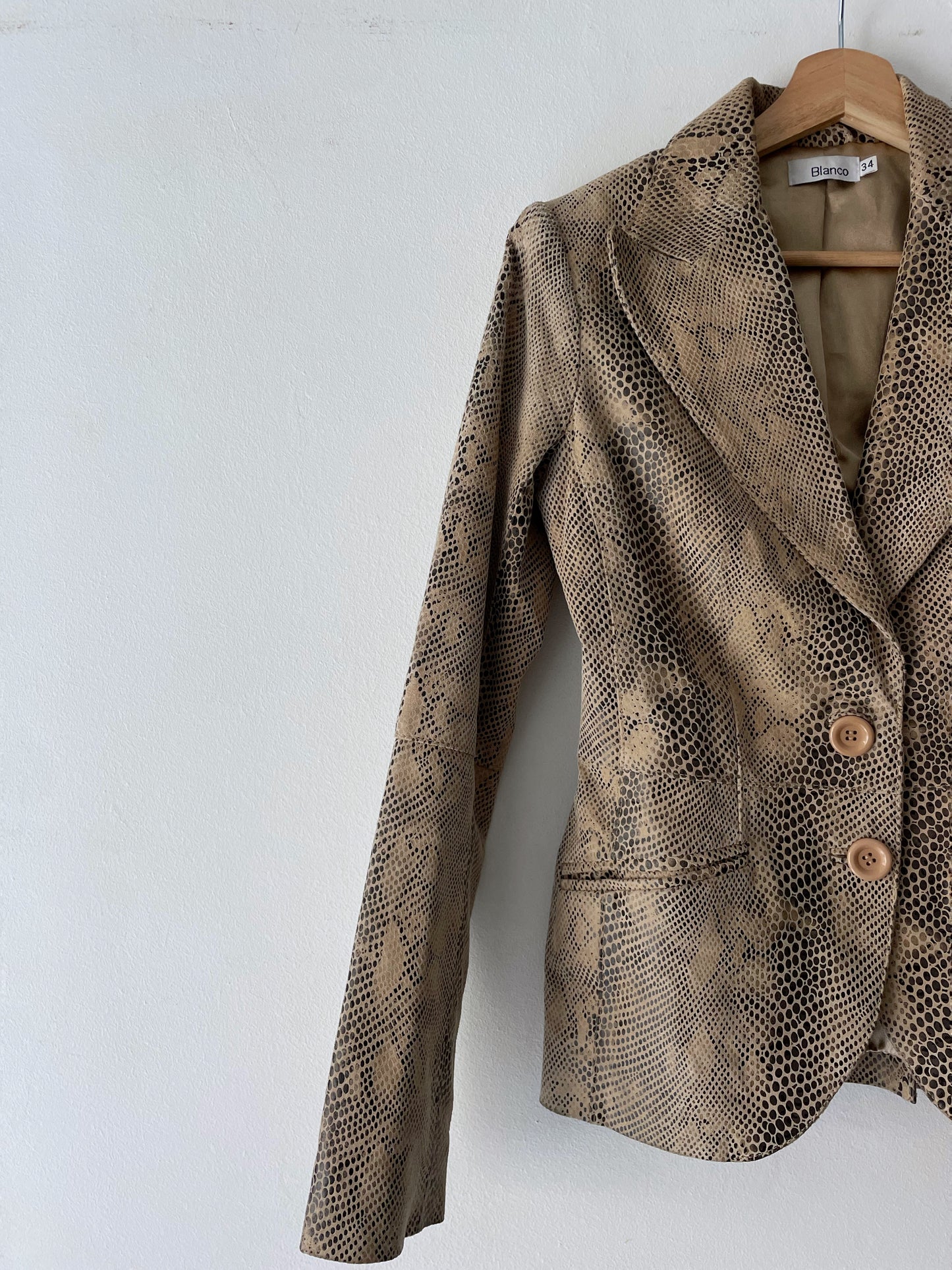 Snake skin print leather jacket.