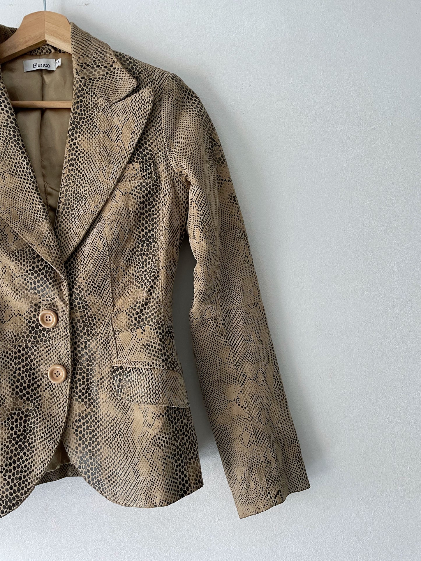 Snake skin print leather jacket.