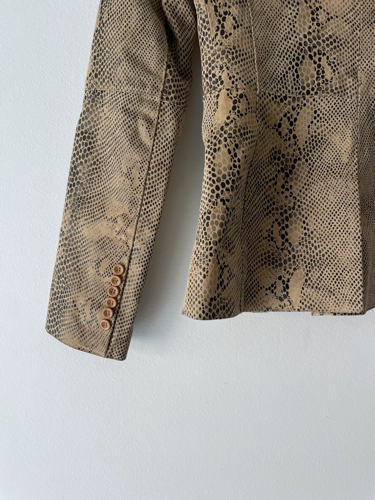 Snake skin print leather jacket.