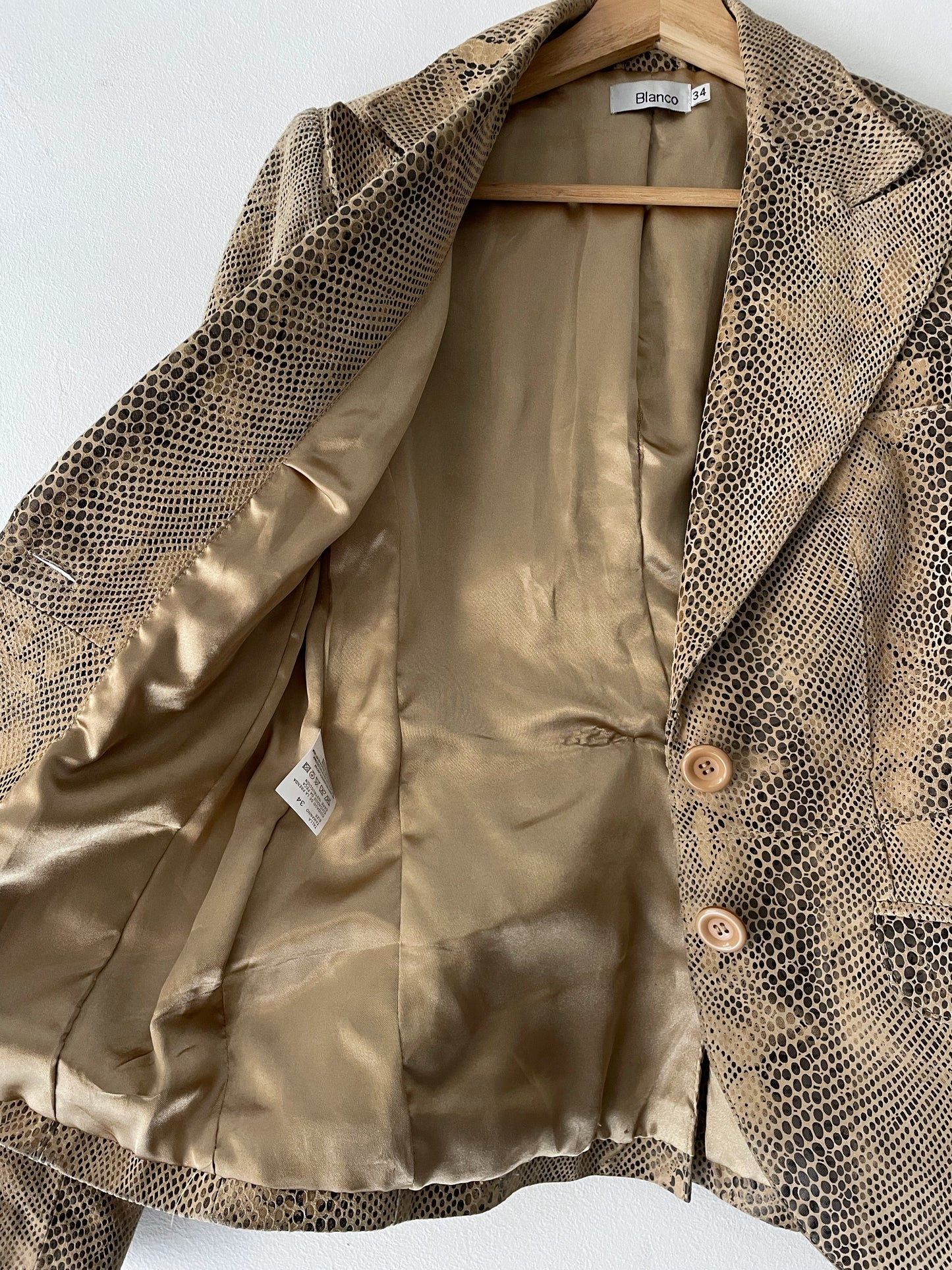 Snake skin print leather jacket.