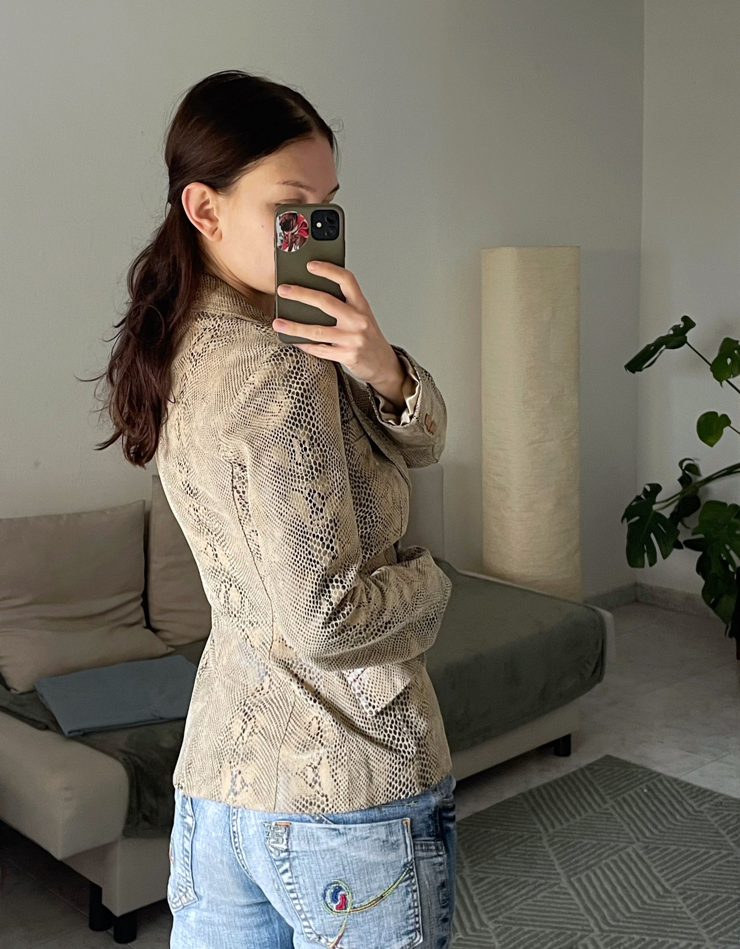 Snake skin print leather jacket.