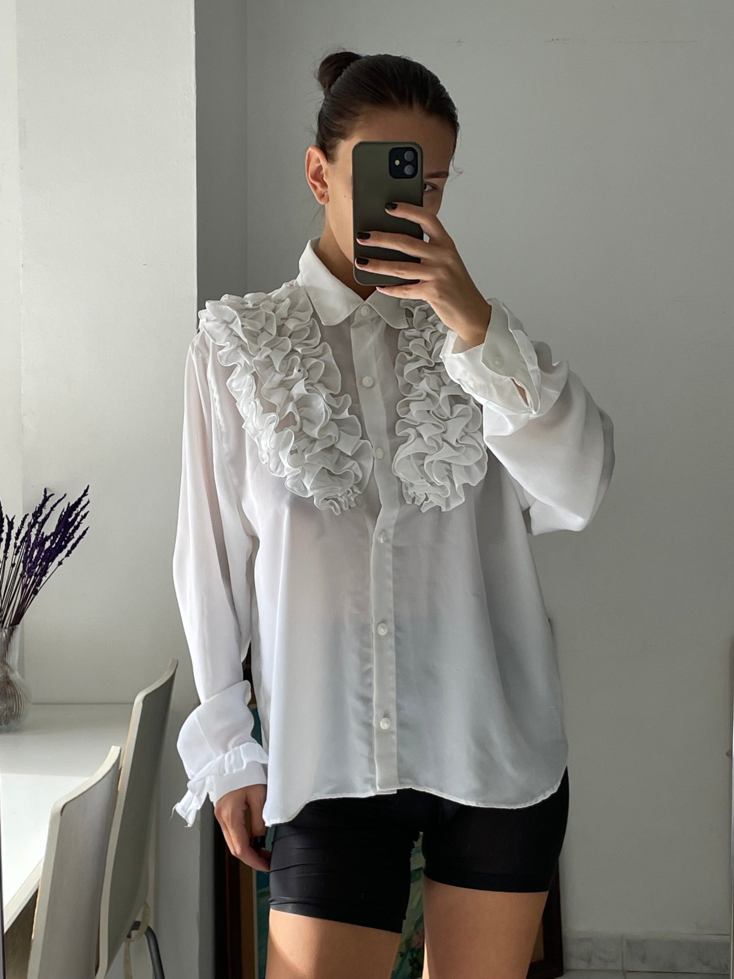 White ruffled blouse.