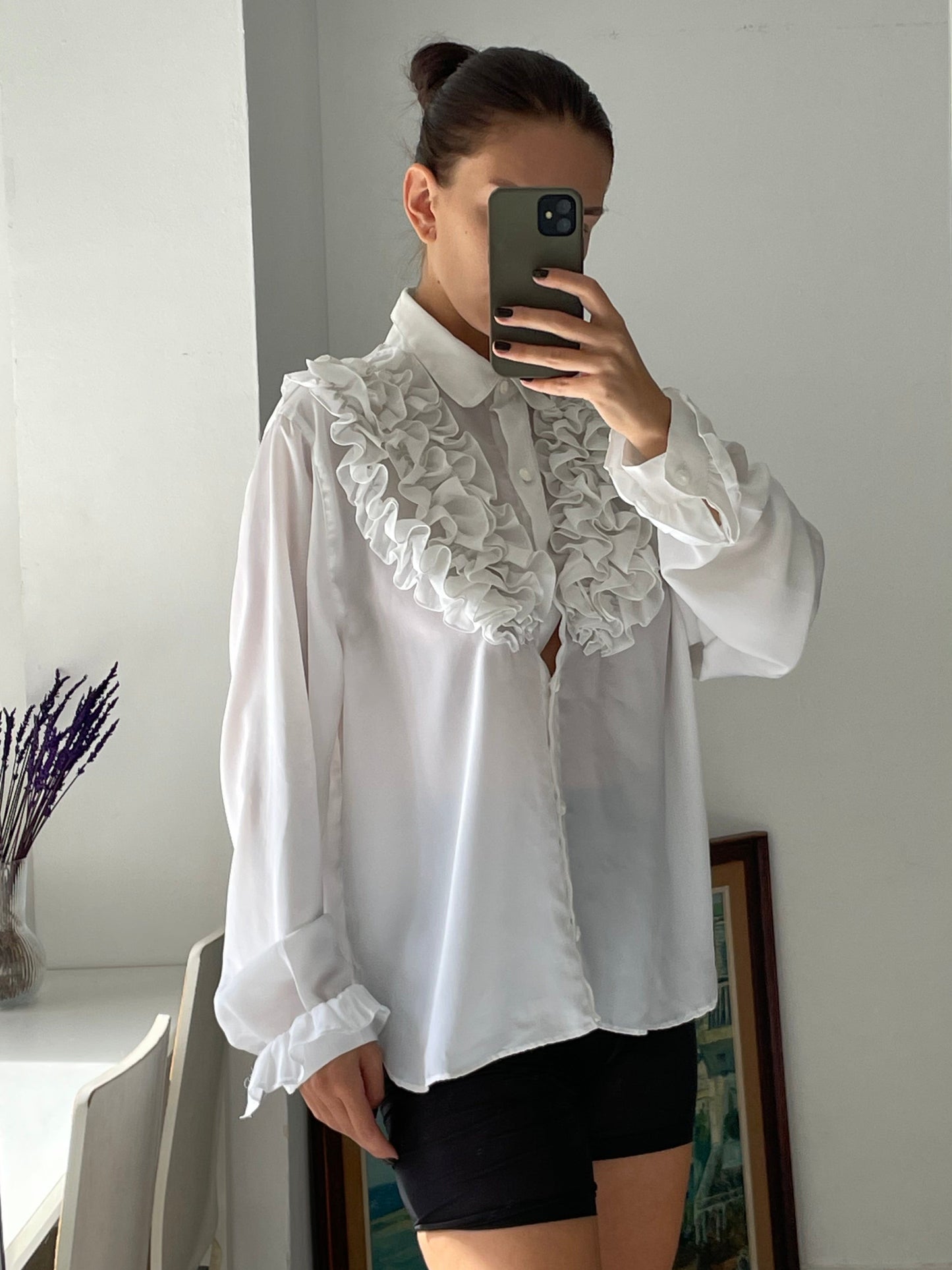 White ruffled blouse.