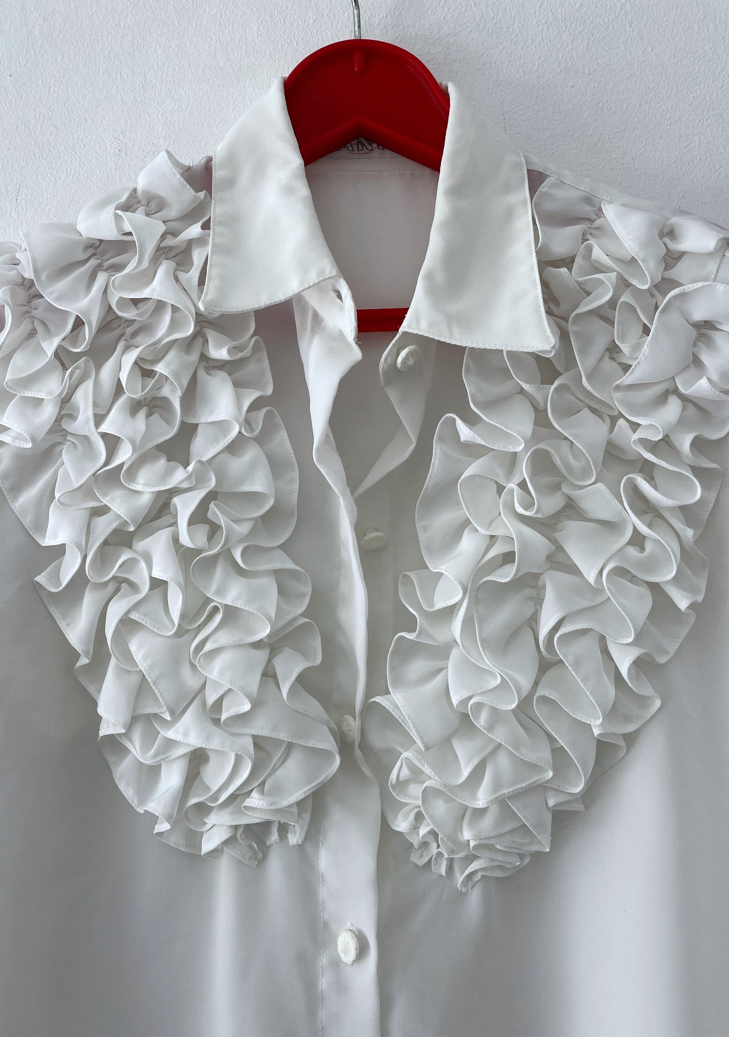 White ruffled blouse.