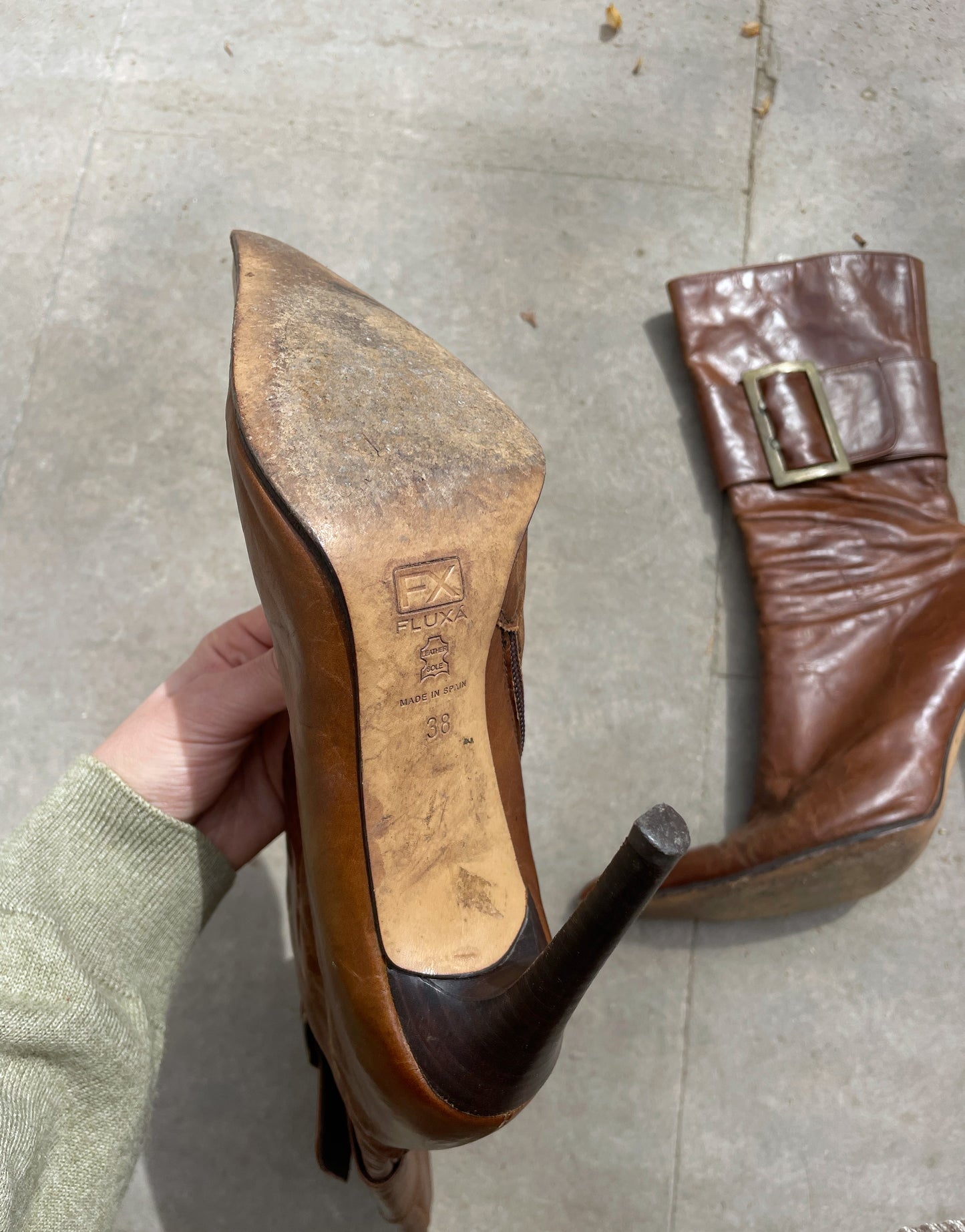 Buckled hight heel boots.