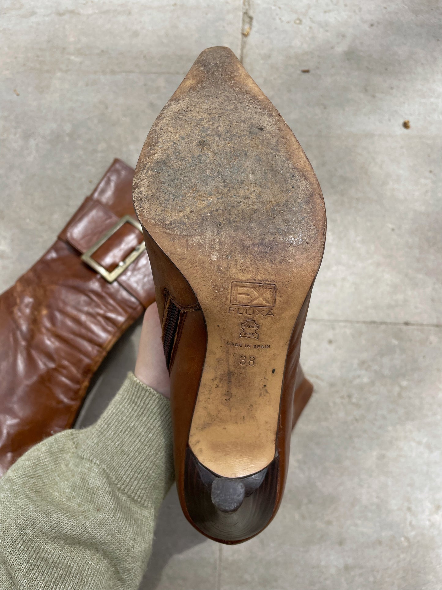 Buckled hight heel boots.