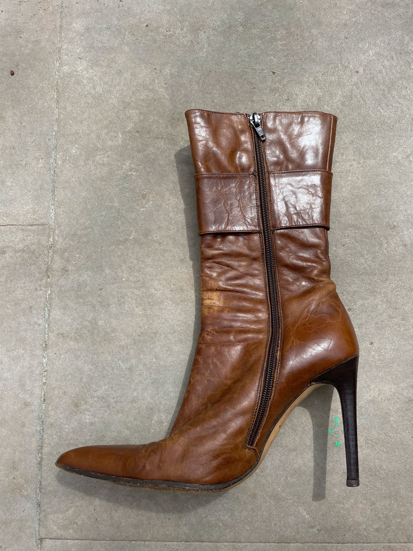 Buckled hight heel boots.