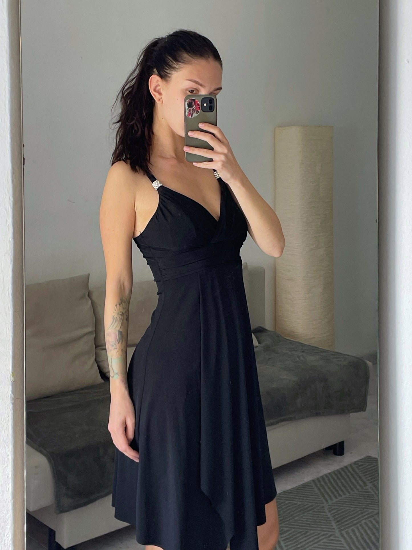 Mini black dress.